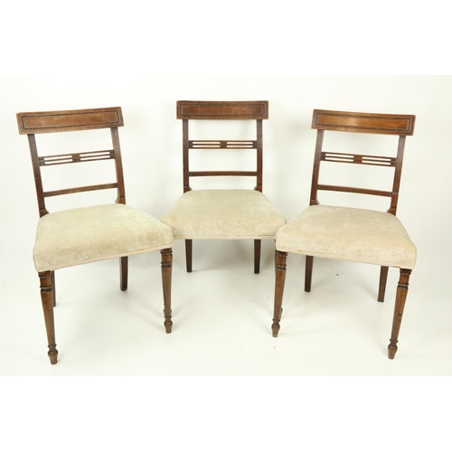 488 - A set of 3 late George III mahogany Dining Chairs, each with a pierced centre splat and  curved top ... 