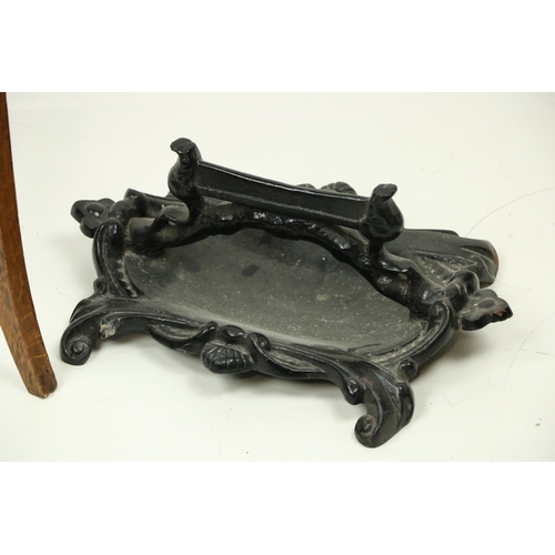 496 - A heavy cast iron black painted Footscrapper, together with an oak copper bound Plant Stand on three... 