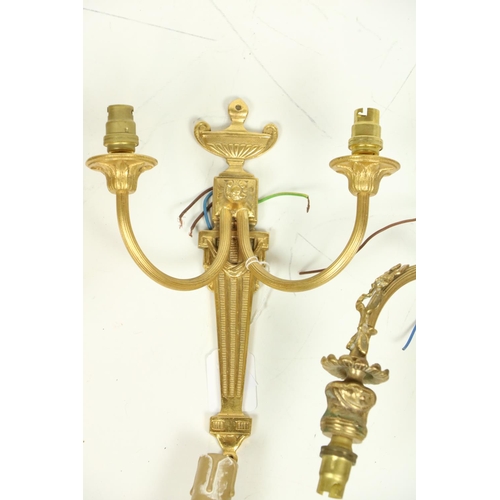 506 - A pair of cast gilt brass two branch Wall Lights; together with another pair of two branch Wall Ligh... 