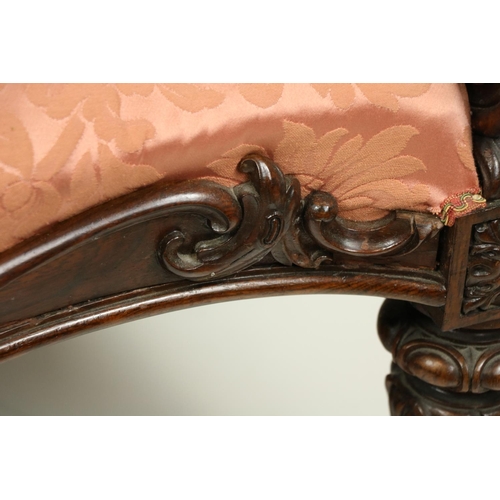 520 - A very fine carved rosewood and serpentine fronted Settee, the top rail with a cartouche crest ... 