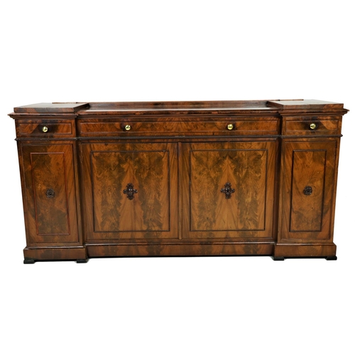 527 - A fine quality mid-19th Century flamed mahogany inverted Sideboard, the shaped top with inset centre... 