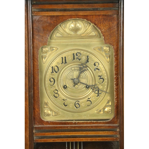 533 - A Vienna beech Wall Clock, with arched brass dial and Arabic numerals and a circular brass pendulum ... 