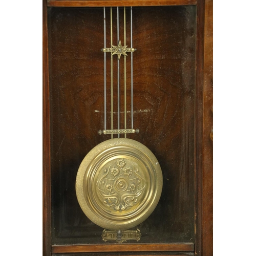 533 - A Vienna beech Wall Clock, with arched brass dial and Arabic numerals and a circular brass pendulum ... 