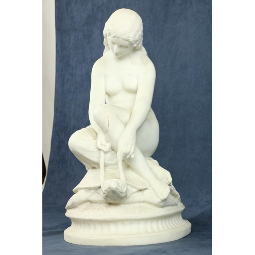 97 - A 19th Century carved marble Group, a semi-nude Woman seated on a tortoise on oval base, 20