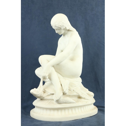 97 - A 19th Century carved marble Group, a semi-nude Woman seated on a tortoise on oval base, 20