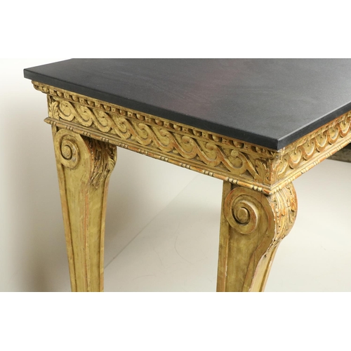 99 - A fine pair of William Kent style carved giltwood Console Tables, each with a Vitruvian scroll carve... 