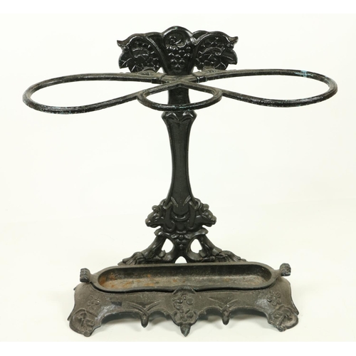 1002 - A Victorian cast iron Stick and Umbrella Stand, decorated with grapes and vine leaves on shaped base... 