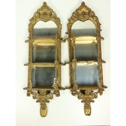 1007 - A very attractive pair of gilt Mirror Wall Brackets, each with a stylized shell crest above three sh... 