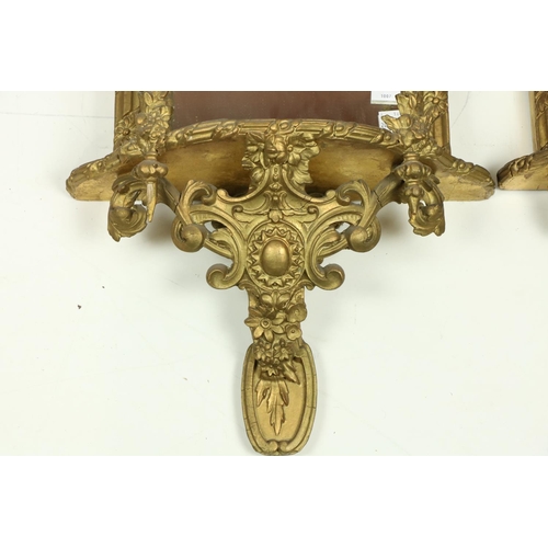 1007 - A very attractive pair of gilt Mirror Wall Brackets, each with a stylized shell crest above three sh... 