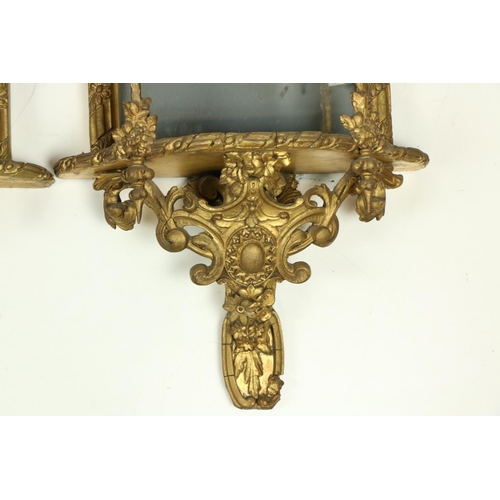 1007 - A very attractive pair of gilt Mirror Wall Brackets, each with a stylized shell crest above three sh... 