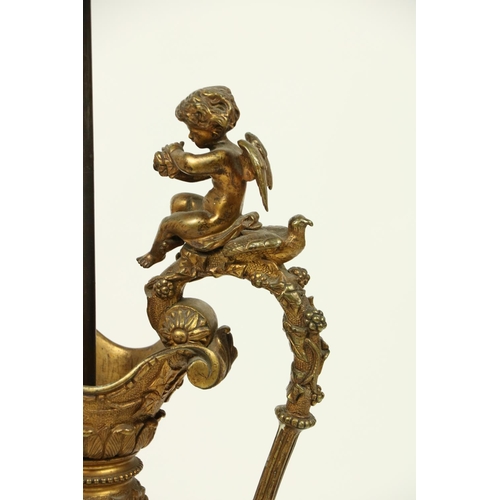 1038 - A heavy Neo-Classical style bronze and gilt bronze Ewer, with rustic handles surmounted, a cherub te... 