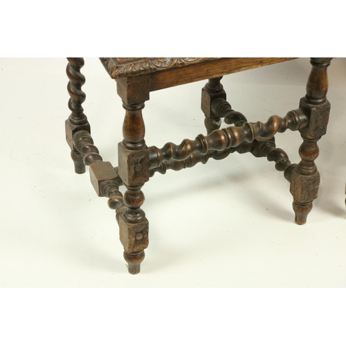 1057 - A pair of 17th Century style carved oak Side or Hall Chairs, each with solid seat. (2)... 