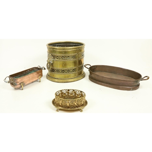 1059 - A heavy oval pierced brass Wastepaper Bin or Turf Holder, with lion mask and ring handles, 12