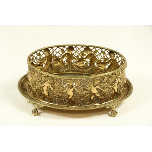 1059 - A heavy oval pierced brass Wastepaper Bin or Turf Holder, with lion mask and ring handles, 12