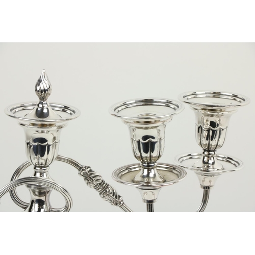 615 - A good pair of Sheffield plated two branch - three light Candelabra, with scrolling reeded arms, 15 ... 