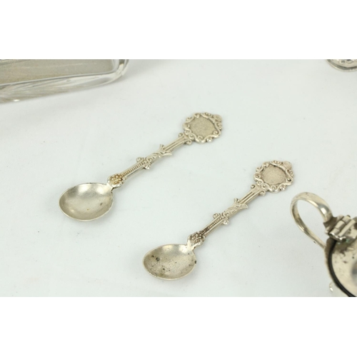 622 - A small silver Sugar & Cream, some silver Condiments, two small silver Figurines, a silver toppe... 