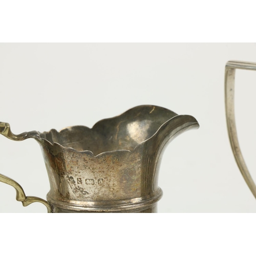 626 - Three English silver Cream Jugs, two with half reeded bodies, and one with paw feet. (3)... 