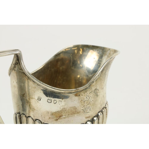 626 - Three English silver Cream Jugs, two with half reeded bodies, and one with paw feet. (3)... 