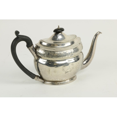 630 - A large boat shaped oval English silver Teapot, with bright cut decoration and armorial crests, Lond... 