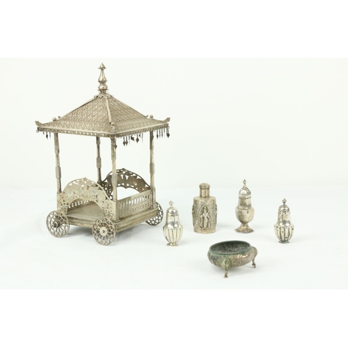 637 - An Indian pagoda style Butter Wagon, (lacking liner) in white metal on four wheels, 9