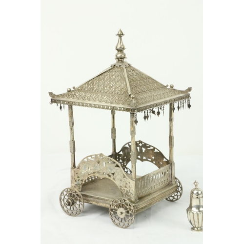 637 - An Indian pagoda style Butter Wagon, (lacking liner) in white metal on four wheels, 9