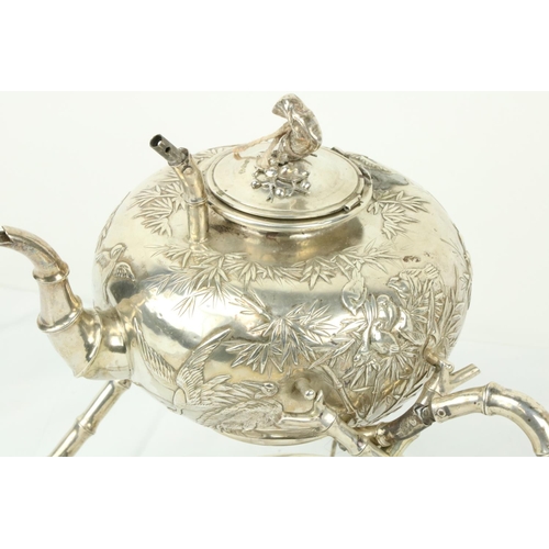 638 - A Japanese Export silver Tea Kettle, on simulated bamboo stand with spirit lamp, the kettle chased w... 