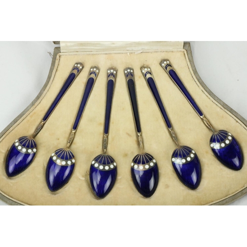 649 - A very attractive cased set of 6 Art Deco blue enamel and silver gilt Coffee Spoons, together with a... 