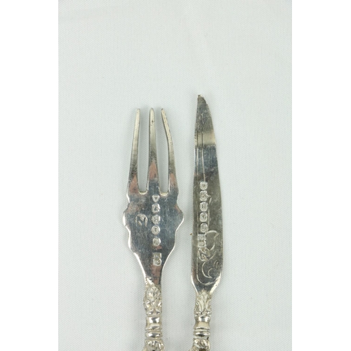 682 - A set of 11, (6+ 5) small silver Fruit Knives & Forks, with decorated handles. (11)... 