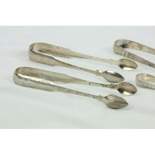 697 - A bright cut silver Sugar Tongs, two similar plain ditto, and two smaller ditto. (5)... 