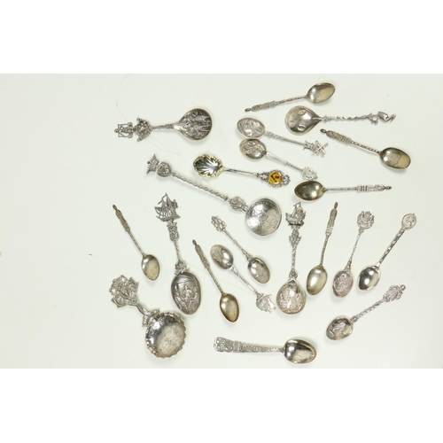 711 - A good collection of over 20 English & Continental silver Souvenir Spoons, attractively decorate... 