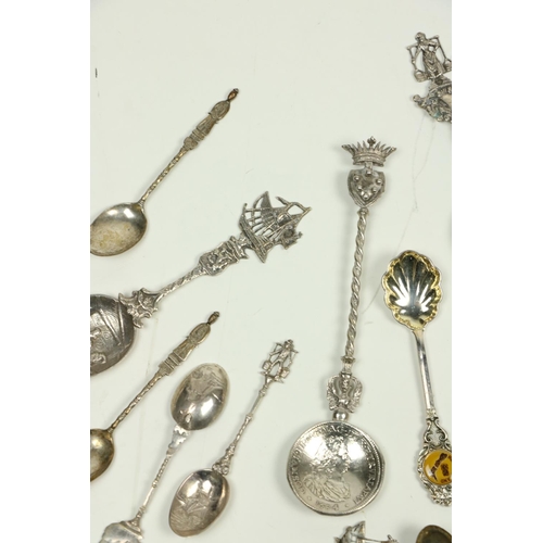 711 - A good collection of over 20 English & Continental silver Souvenir Spoons, attractively decorate... 