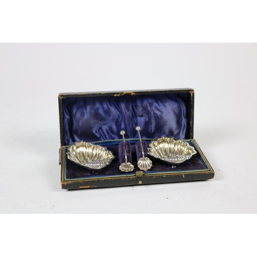 714 - A pair of silver Salts, Chester, formed as shells and two matching spoons, cased, together with a si... 