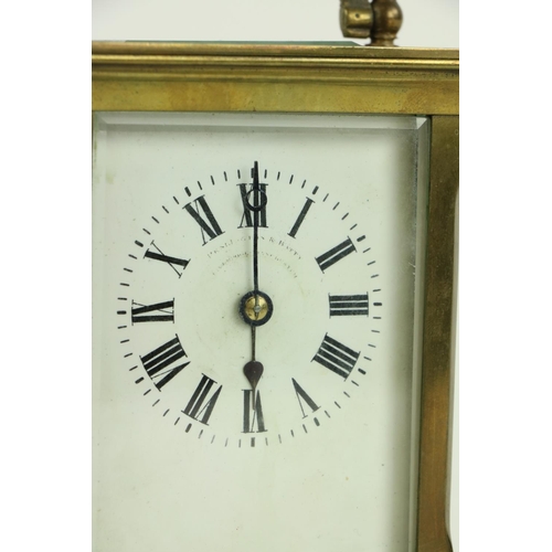 748 - A heavy brass five glass French Carriage Clock, the white dial with Roman numerals and with swing ha... 