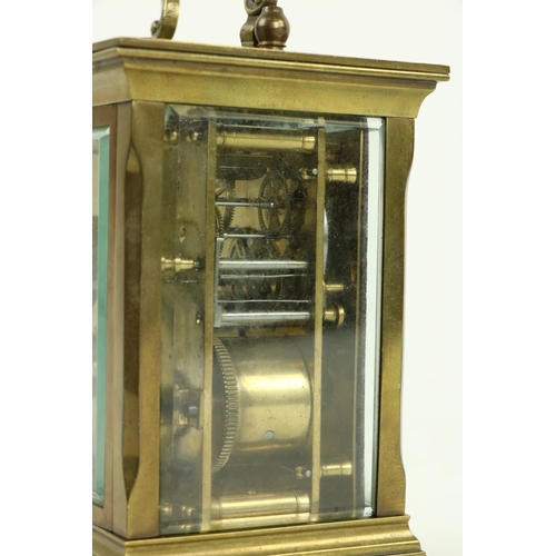 748 - A heavy brass five glass French Carriage Clock, the white dial with Roman numerals and with swing ha... 