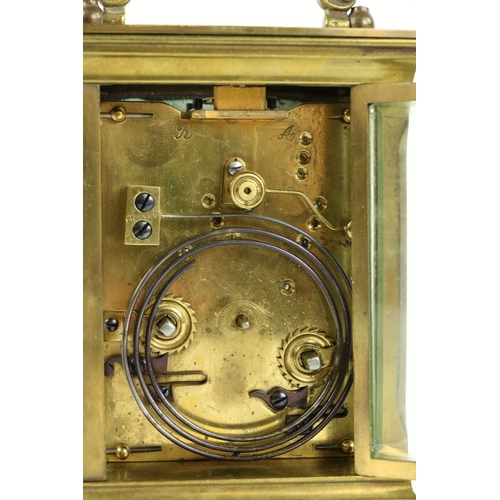 748 - A heavy brass five glass French Carriage Clock, the white dial with Roman numerals and with swing ha... 