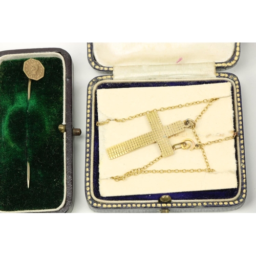 762 - A 9ct gold Crucifix with matching chain, together with another engraved gold Crucifix Pendant and th... 