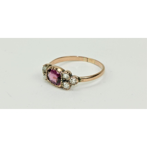 780 - An 18ct gold Ring, with centre oval garnet (Rhodolite), surrounded by six small princess cut round d... 