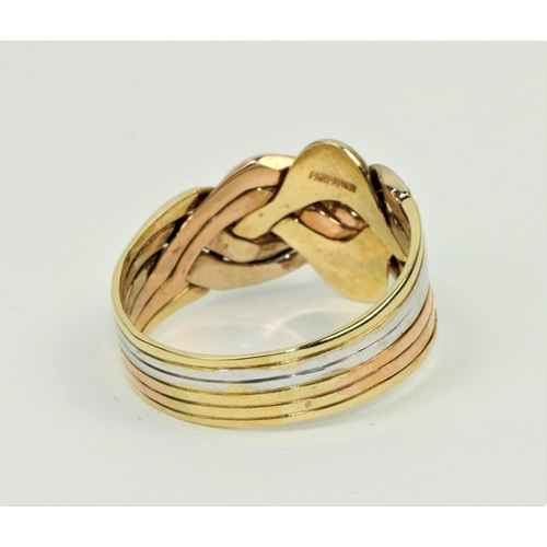 791 - An attractive and unusual three coloured gold Gentleman's 18ct Ring, of Celtic design, hallmarked. (... 