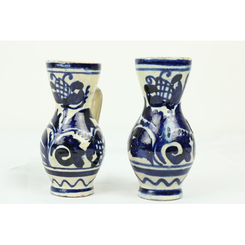 850 - A pair of late 17th / early 18th Century London Delft blue and white water/wine Cruets, each approx.... 