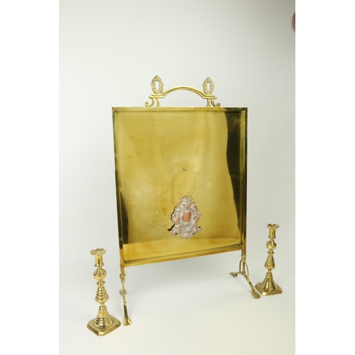 864 - A brass Cheval Fire Screen, and a pair of brass Candlesticks, 10