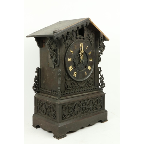 879 - A German carved wooden Cuckoo Clock, Black Forest with arched top and circular dial with Roman numer... 