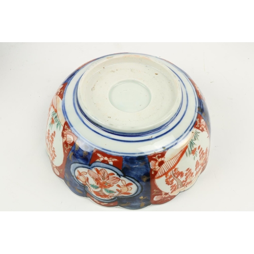 893 - A good late 18th Century Nankin blue and white porcelain Bowl, another larger Famille Rose type ditt... 