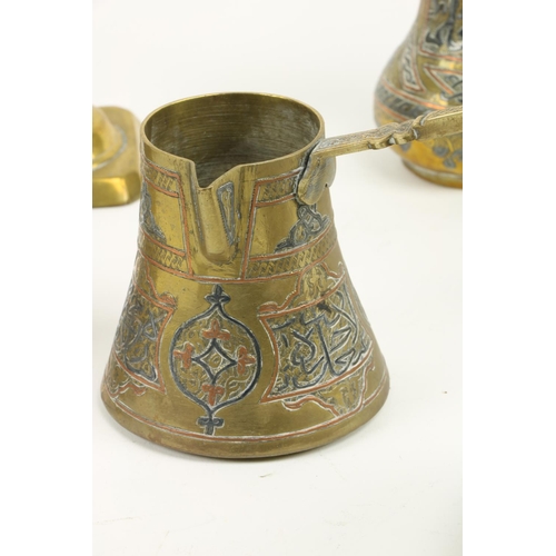 895 - A middle Eastern brass and inlaid Coffee Pot, with Islamic inscriptions, 8