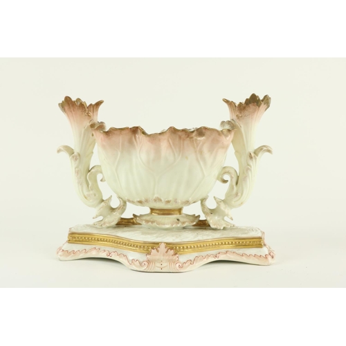 906 - A 19th Century Moore Brothers porcelain Centerpiece, with leaf moulded bowl and two side vases on a ... 