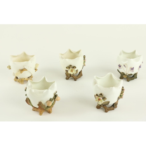 908 - A set of 3 small Moore Brothers porcelain Bowls, encrusted with flowers against a white ground on th... 