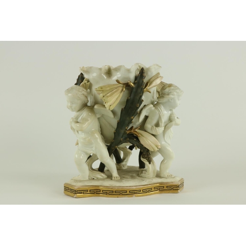 933 - A fine 19th Century Moore Brothers porcelain Table Centre, with three cherubs supporting a bowl with... 