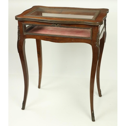 935 - A serpentine shaped walnut and brass mounted Curio Display Table, with five glazed panels, on four c... 