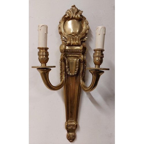 938 - A pair of cast brass quiver shaped two branch Wall Lights, each with cartouche crest and hanging lea... 