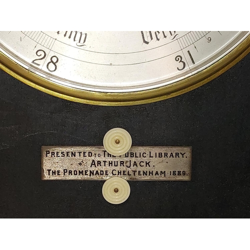 969 - A late Victorian ebonised Barometer and Thermometer, with silvered dials, and bone turned handles, w... 