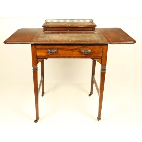 972 - A walnut Ladies drop leaf Writing Table, with two rectangular flaps, the hinged top opening to revea... 